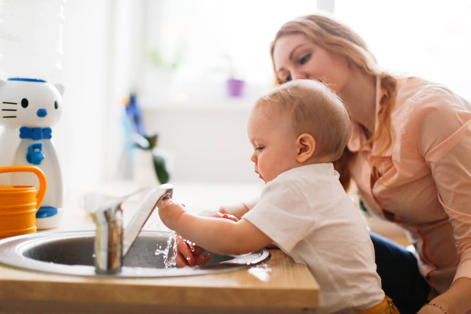 toddler washing hand